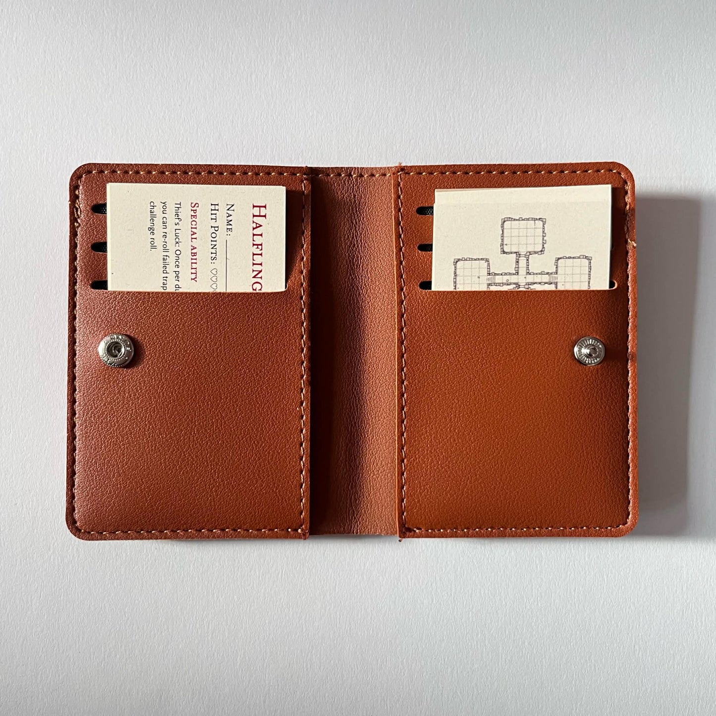 Dungeons & Wallets – Tiny RPG packed in a wallet